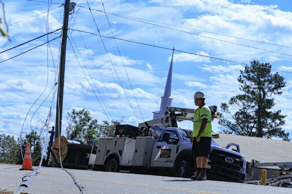 Comcast tech works on downed lines from a major storm event to restore connectivity to customers. 