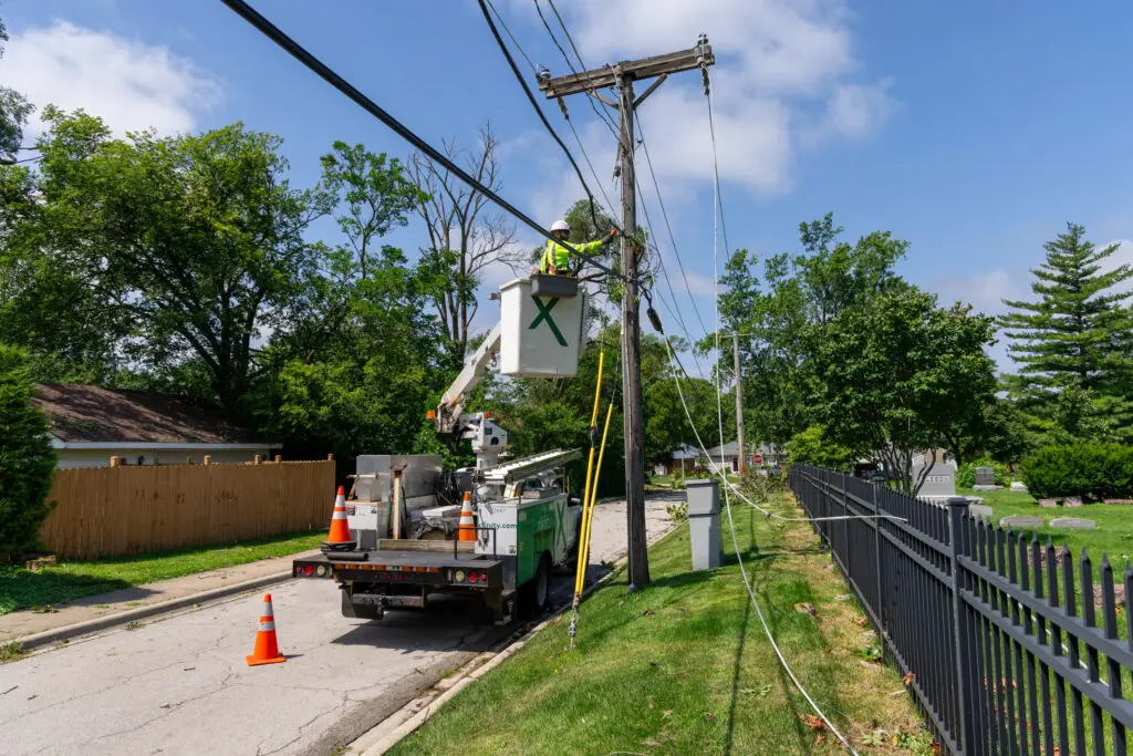 Xfinity bucket truck working in Helene storm response neighborhood.