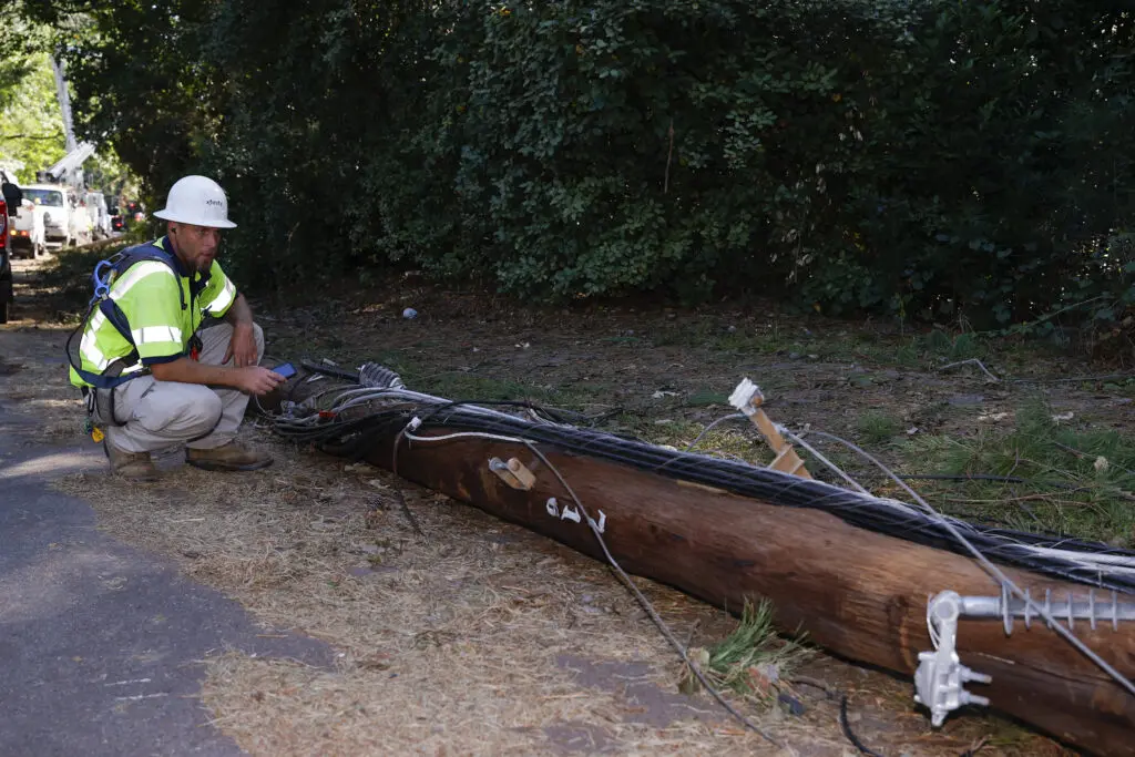 Comcast techs assess damaged lines caused by severe weather.