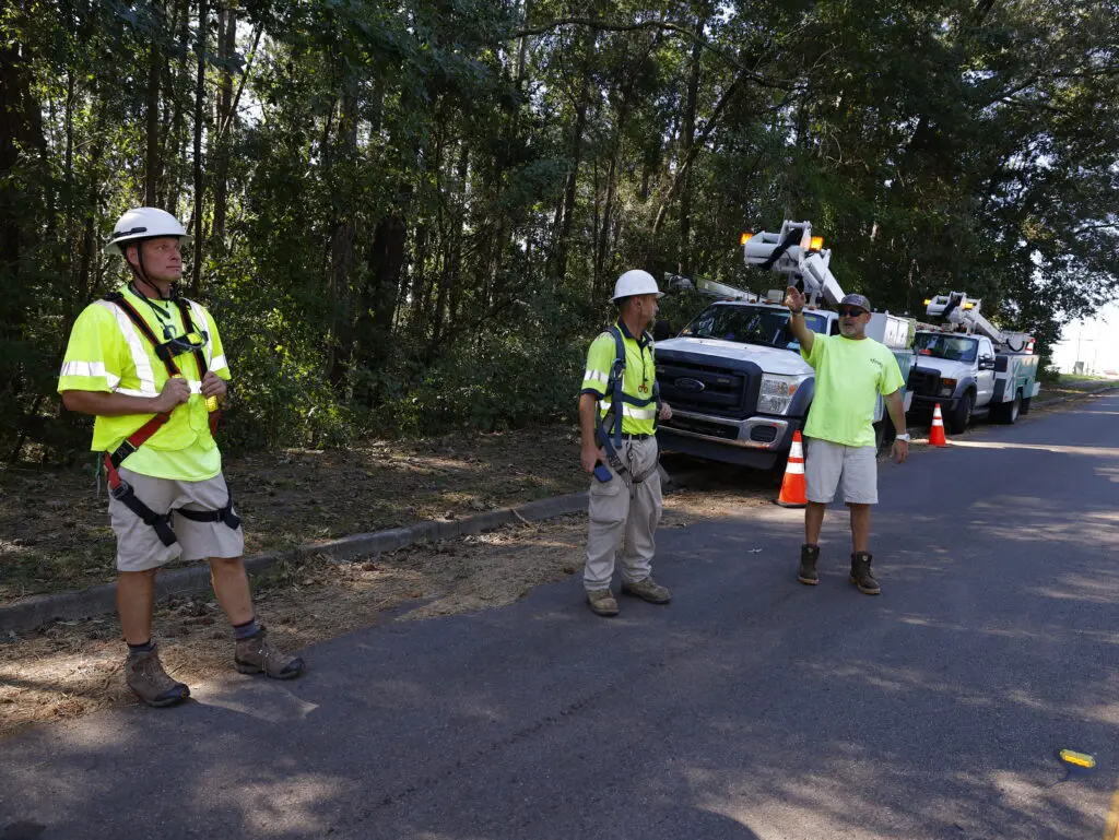 Xfinity technicians and customer discuss restoration efforts after major storm.