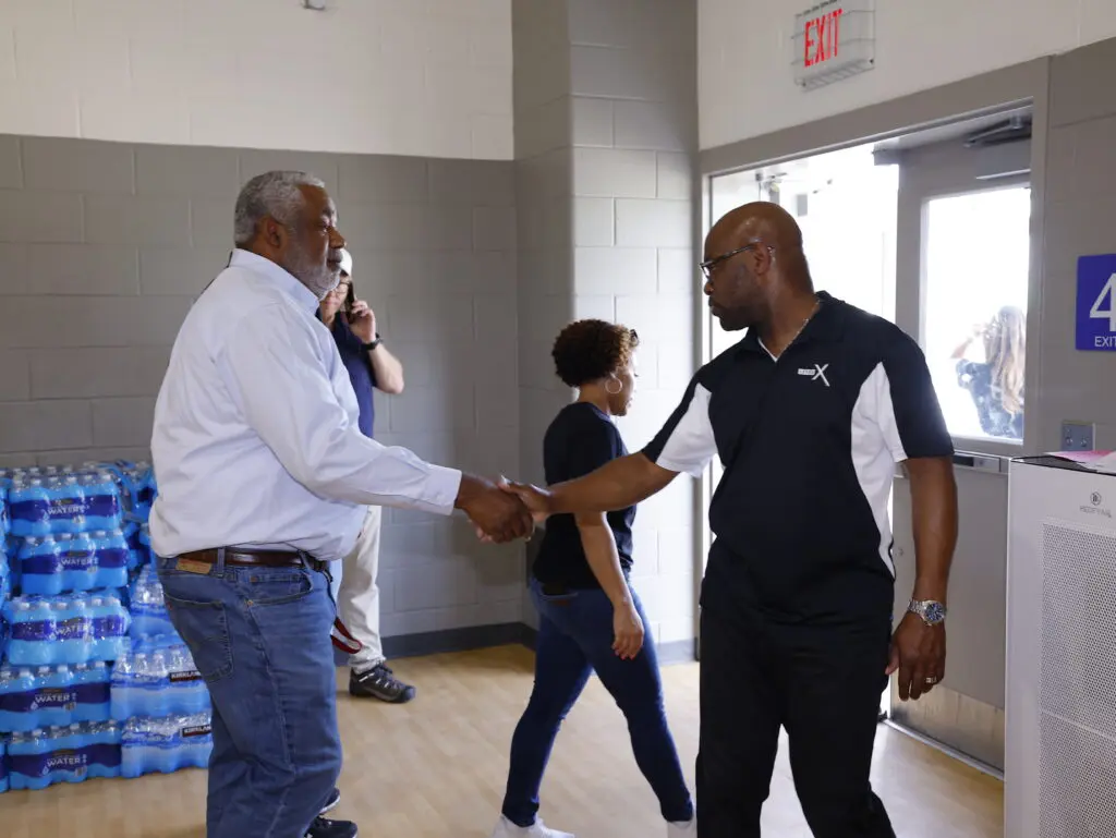 Comcast meets with community members after major storm to support recovery efforts.