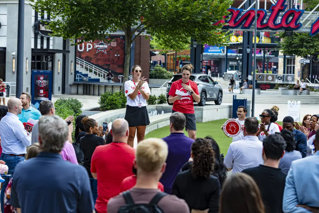 Tracy Pitcher addresses the crowd at a fundraising event