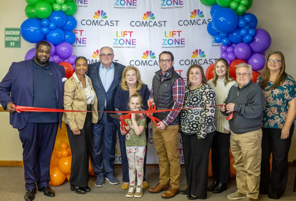 Ribbon cutting of a new Comcast Lift Zone for free and reliable WiFi access for the community.