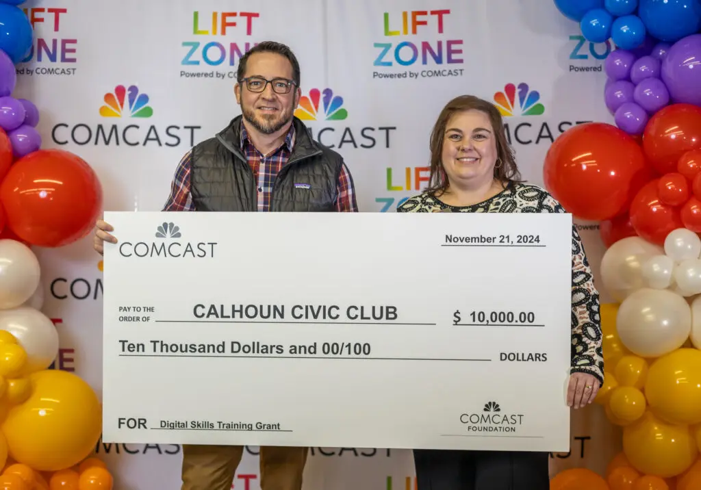 Celebrating the donation of 10,000 to Calhoun Civic Club for digital learning.