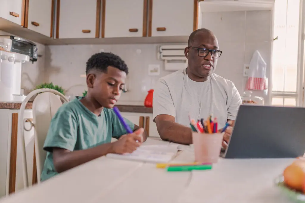 Father and son on laptop