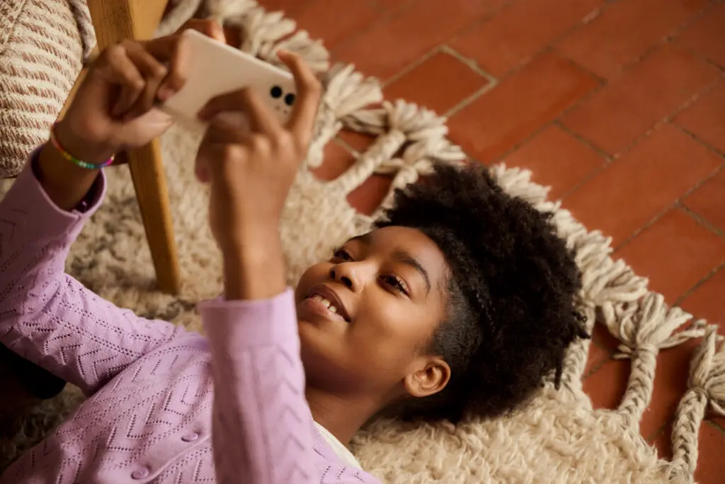Child uses phone with NOW Mobile