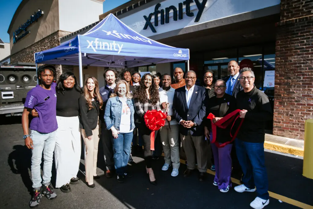 Comcast, Xfinity and Augusta community representatives smile for the Xfinity grand store opening.