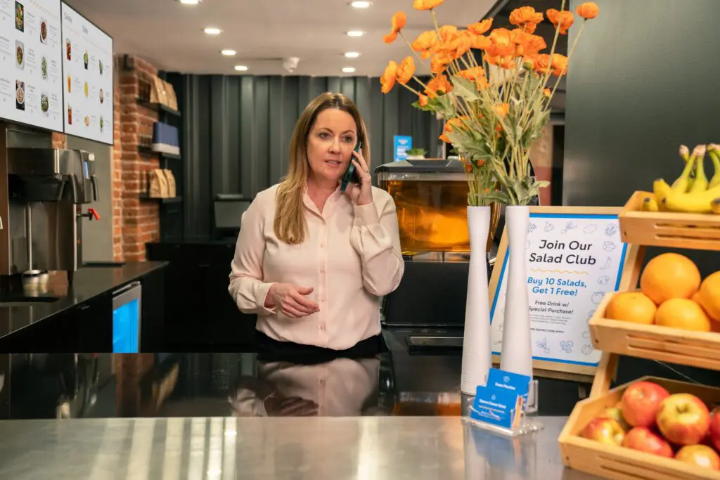 Restaurant owner uses phone with Comcast Business Mobile