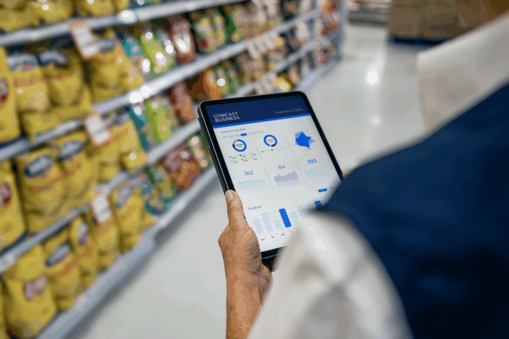 Celebrating small businesses across Illinois during Small Business Month. IMAGE: An employee using a tablet device powered by Comcast Business