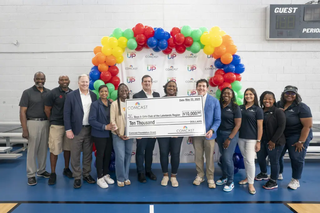Representatives from Comcast present a check to the Boys & Girls Club of the Lakelands region at the Greenwood Comcast Expansion Rally at the Boys and Girls Club Thursday May 22, 2025, in Greenwood, S.C.