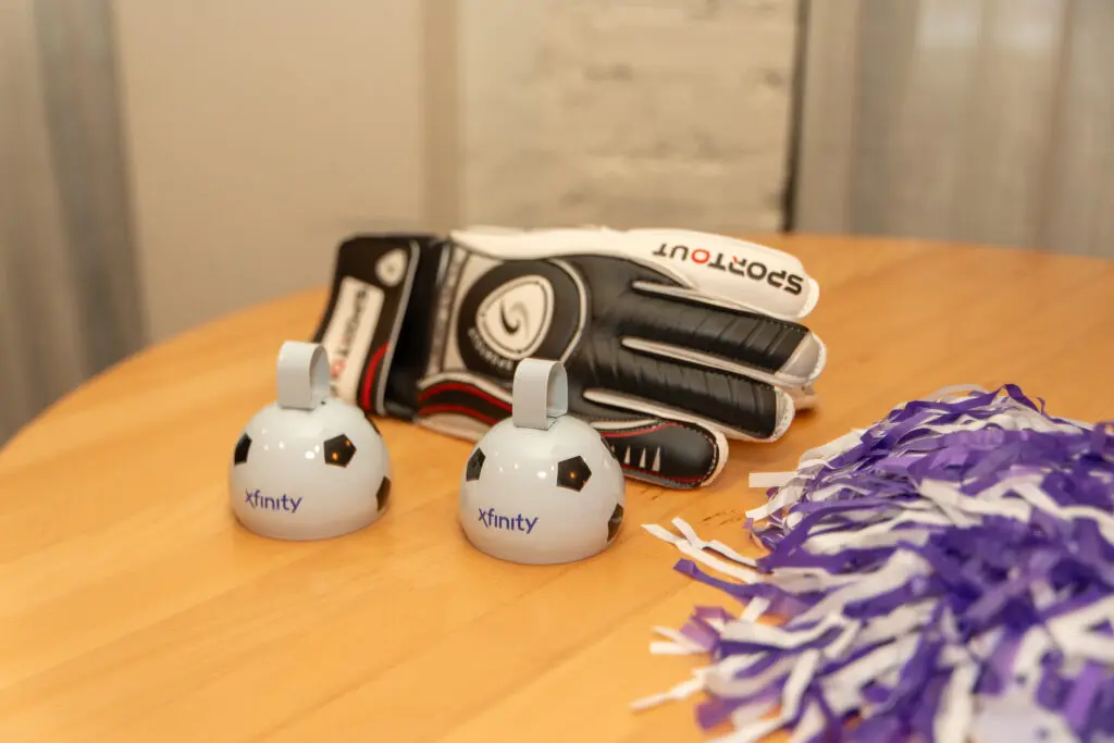 Xfinity-branded items on display at the World Soccer Ticket launch in Atlanta, celebrating the intersection of connectivity, community, and global sports fandom.