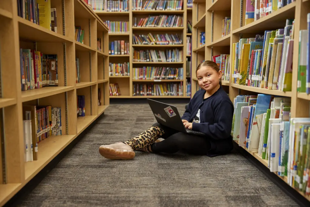Female youth learning digital skills through a digital literacy program offered in Arkansas with support with Comcast's Project UP.