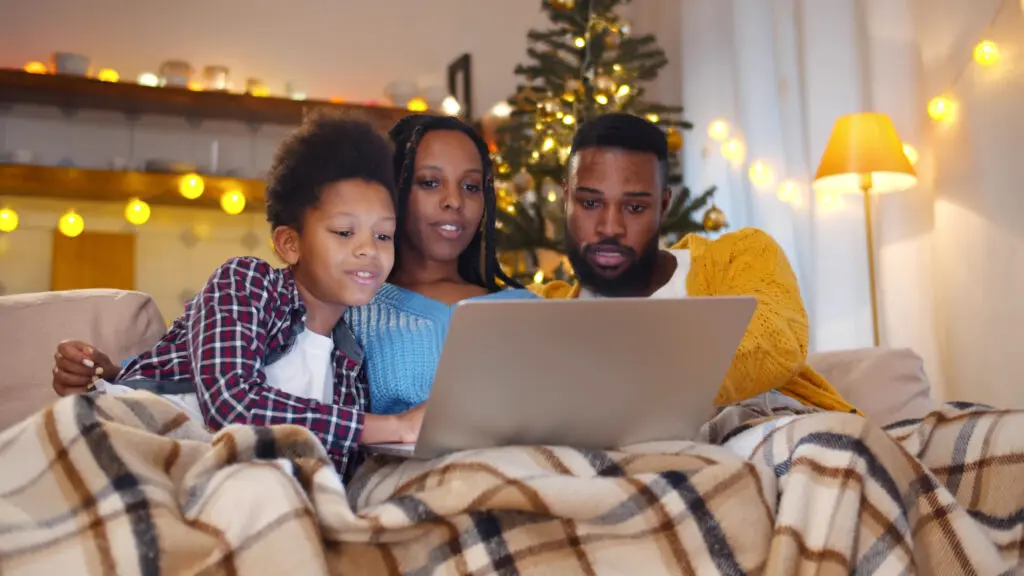 Person video chatting on tablet with family during holiday season, staying connected while shopping Black Friday deals.