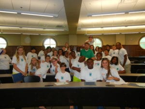 Comcast employee Eric Johnson meets with students from the EYE camp in Mobile, AL.
