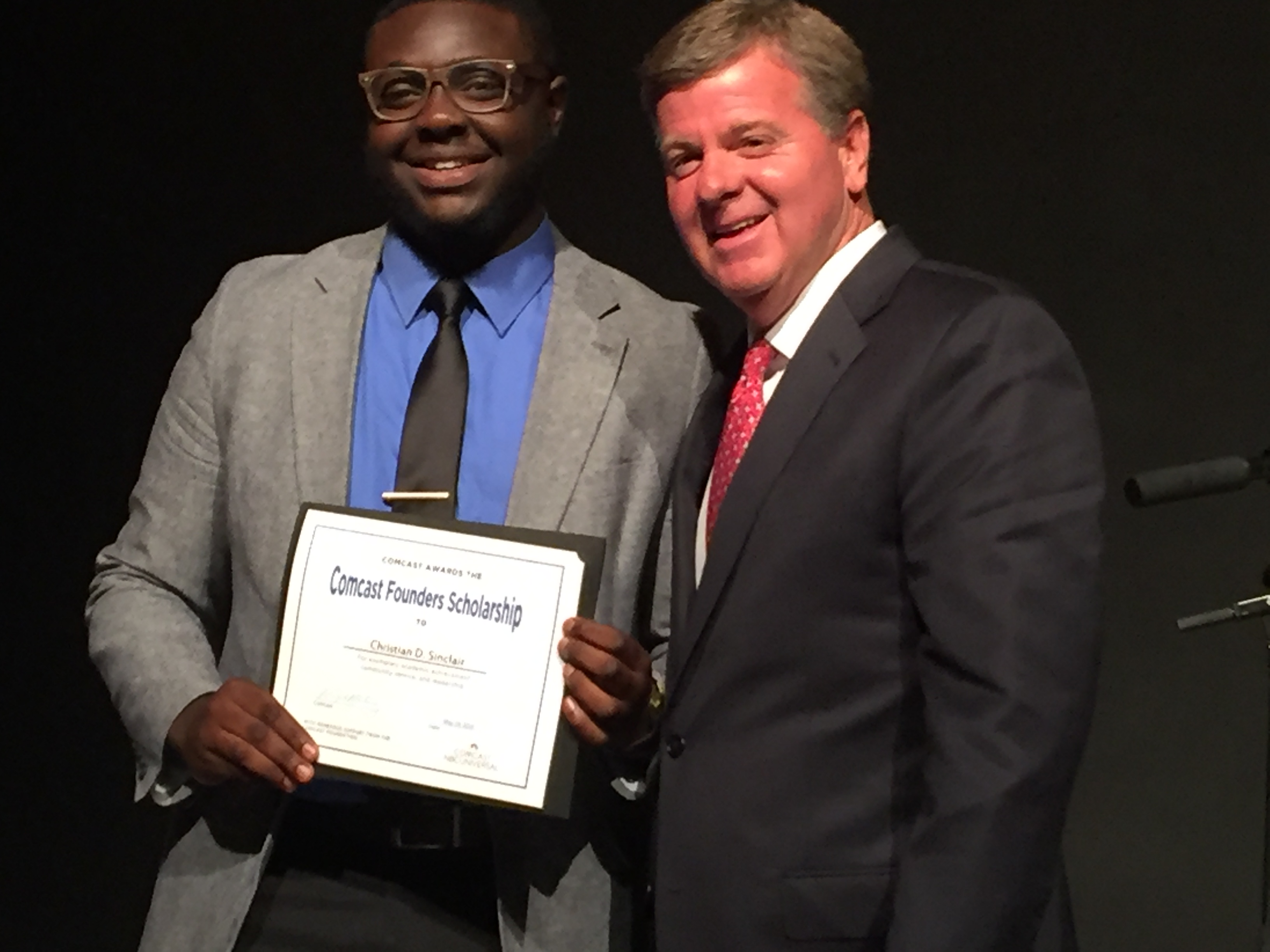 Doug Fisher, Comcast’s Director of External Affairs presented graduating Brainerd High School senior Christian Sinclair with a $5,000 Comcast Founders Scholarship in honor of company founder Ralph Roberts.