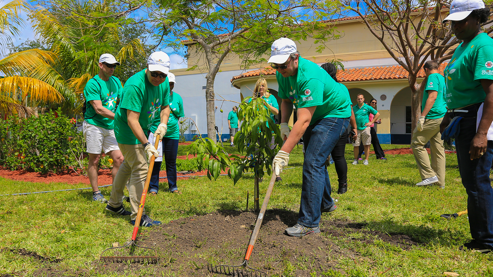 Comcast Cares Day volunteers work on a garden.