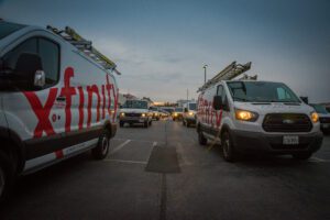 Two Xfinity-branded work trucks.