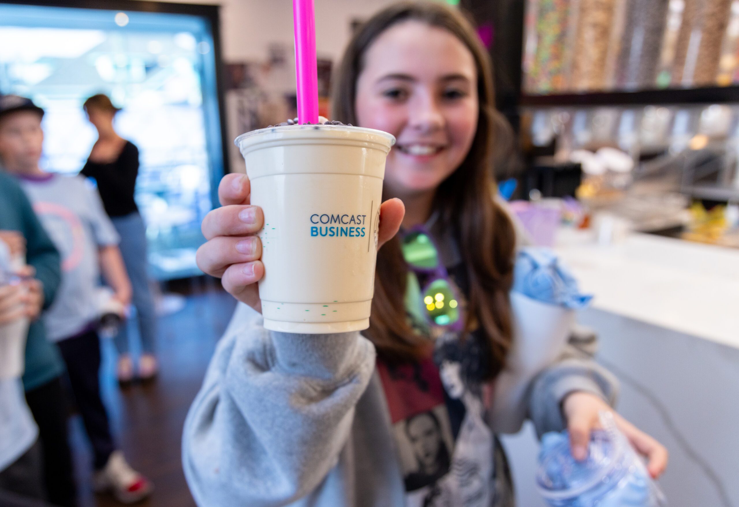 Families enjoying afternoon treats hosted by Comcast Business at Wanna Spoon Cereal Bar in Nashville, Tennessee.