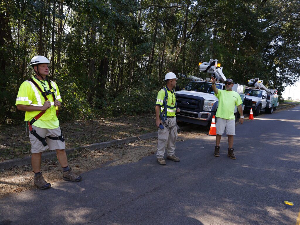 Xfinity technicians and customer discuss restoration efforts after major storm.