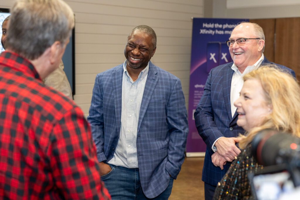 The crowd gathers at the Madison groundbreaking event. (L-R) State Representative Kenji Holloway, Madison County School Superintendent Ted Poore, and Melinda Little, VP of Government Affairs of Comcast Big South.