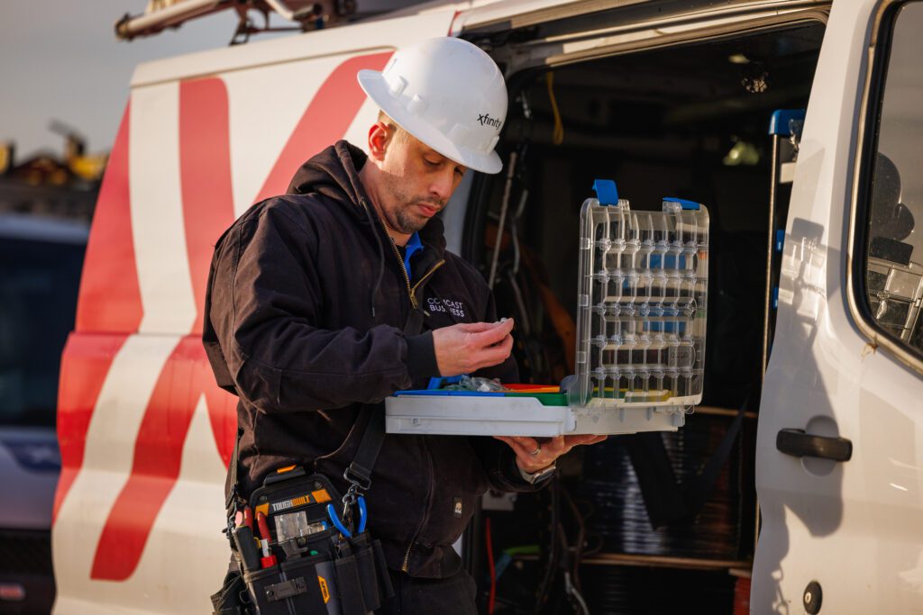 Tech prepares supplies in his Xfinity truck for potential storm damage