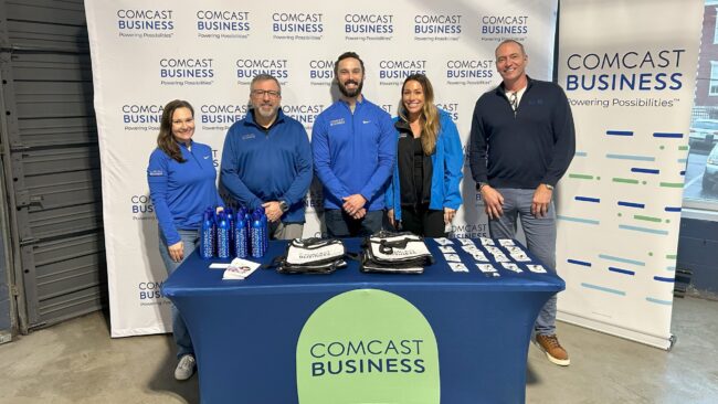 Comcast Business representatives excited to answer attendee's questions at the basketball watch party.