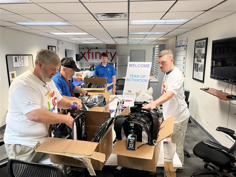 Volunteers stuff backpacks in Tupelo, MS
