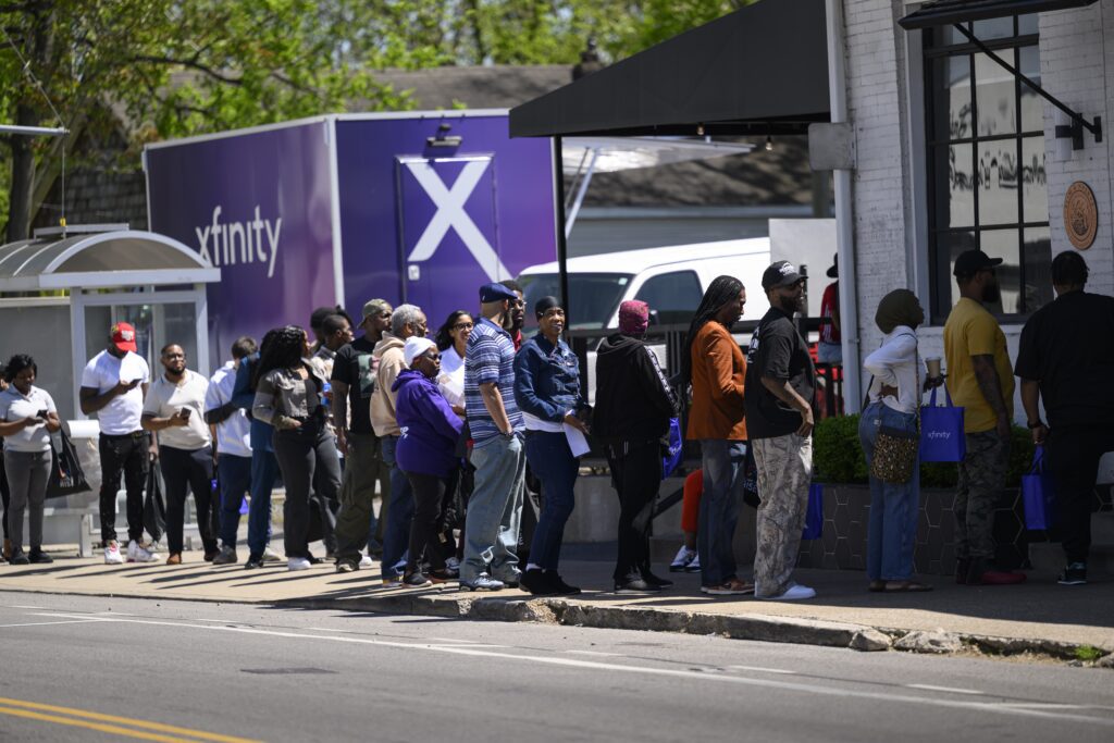 Guests line up for a Comcast RISE 2025 Nashville Block Party taking place at Slim & Husky’s Pizza Berria on Tuesday, April 15, 2025, in Nashville, Tenn.