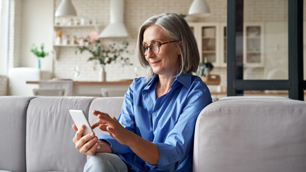Woman spring cleaning her phone apps