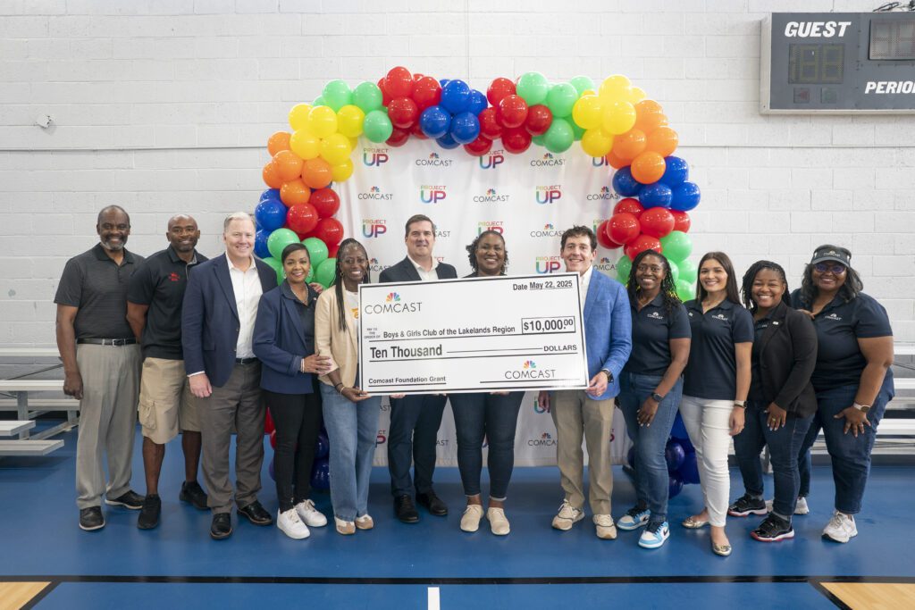 Representatives from Comcast present a check to the Boys & Girls Club of the Lakelands region at the Greenwood Comcast Expansion Rally at the Boys and Girls Club Thursday May 22, 2025, in Greenwood, S.C.